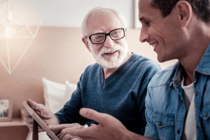 12 Signs Your Loved One Needs A Caregiver - Elderly Man and Young Man Talking
