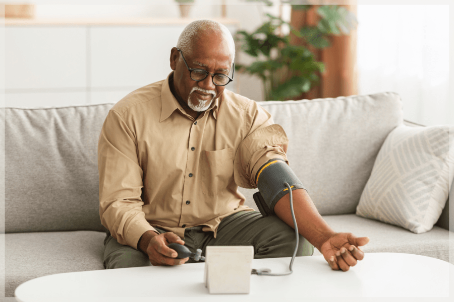 Warning signs of a stroke Senior man using sphygmomanometer cuff to measure blood pressure MeetCaregivers