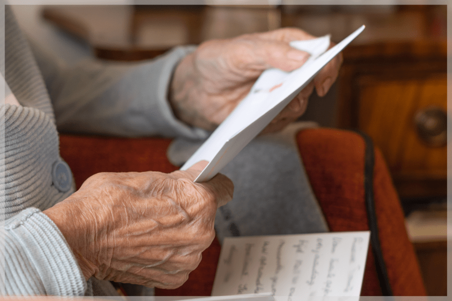 Depression in the elderly Senior person reading letters MeetCaregivers