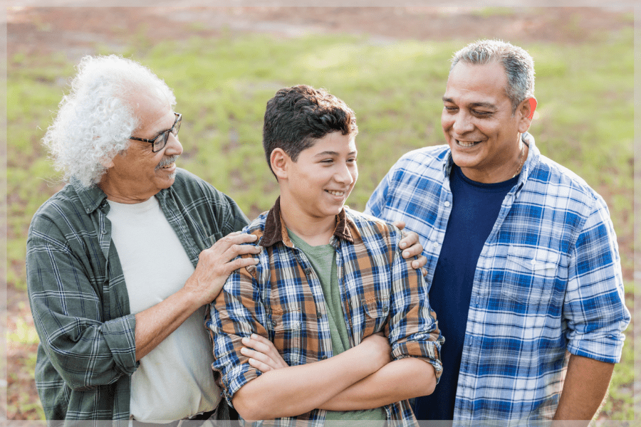 Sandwich generation - Grandfather, son, and grandson smiling together - MeetCaregivers