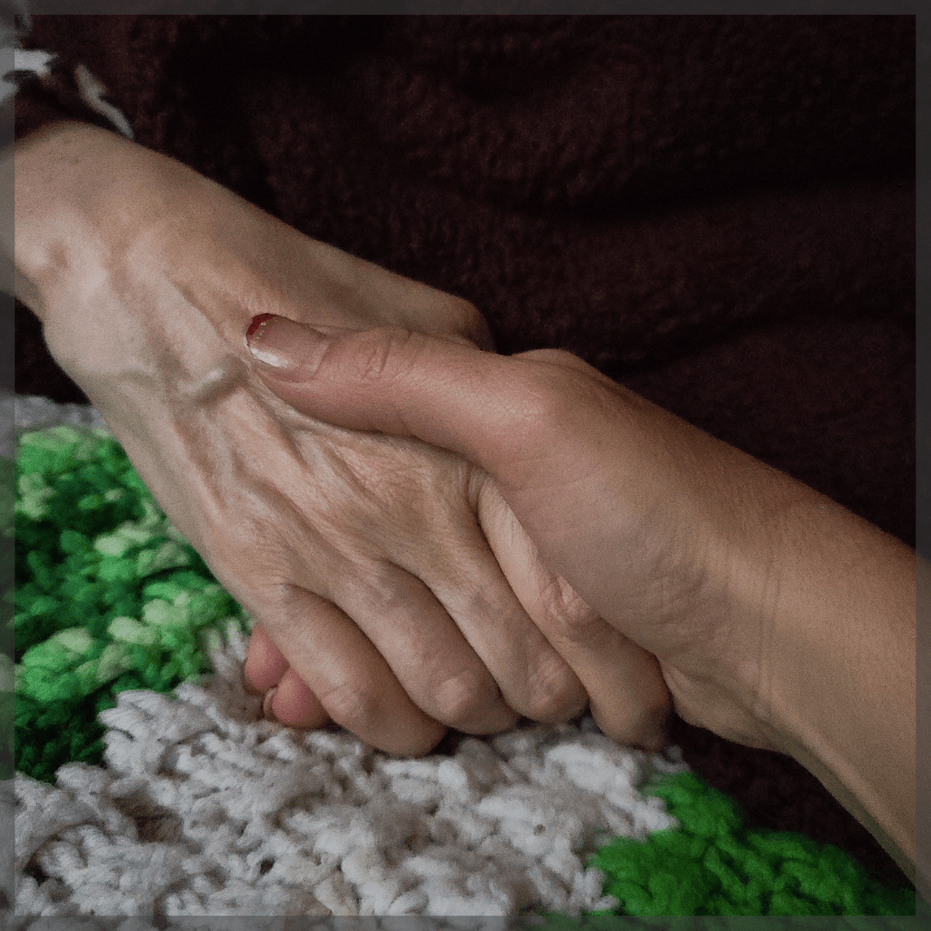 Heart of a caregiver - An elderly person holding a younger person's hand - MeetCaregivers