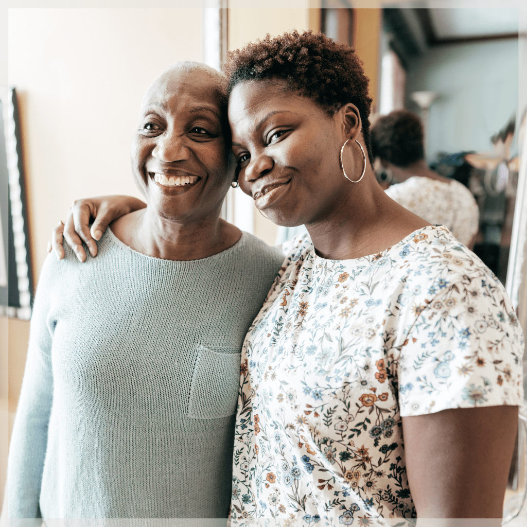 Medicare Reimbursement - Senior mother and her adult daughter embracing happily - MeetCaregivers