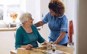 Home Care - A Nurse Talking To A Senior