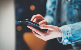 Caregiver - A Pair Of Hands Texting On A Smartphone