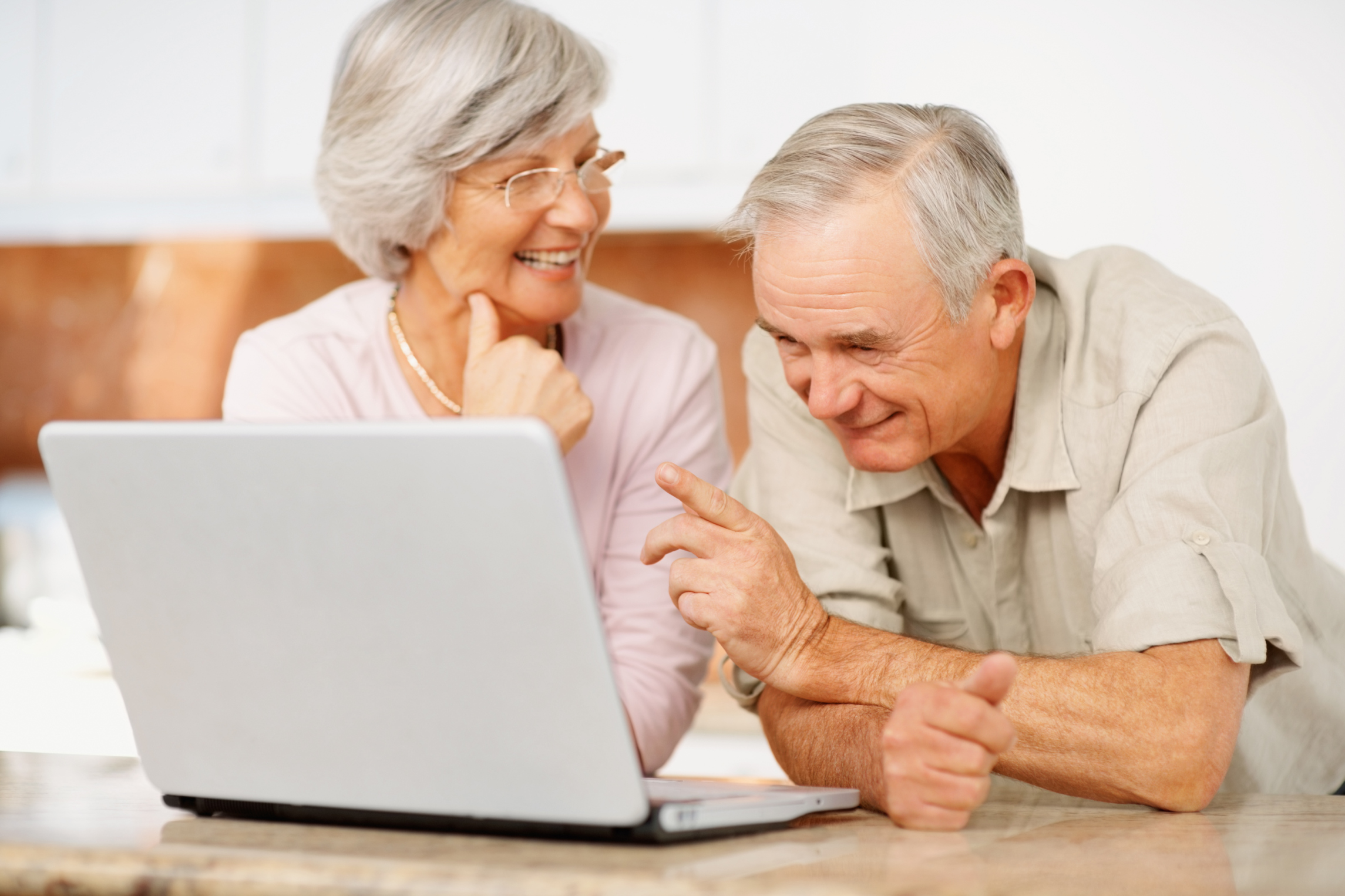 Technology for Seniors - Older Couple On A Laptop