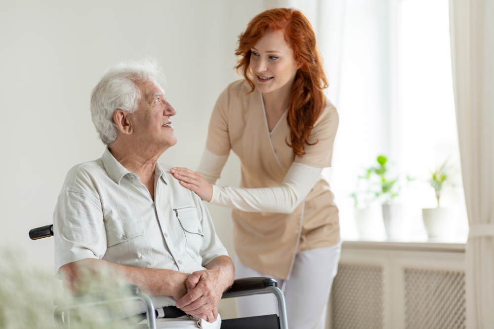Respite Care - Young Woman With An Elderly Man