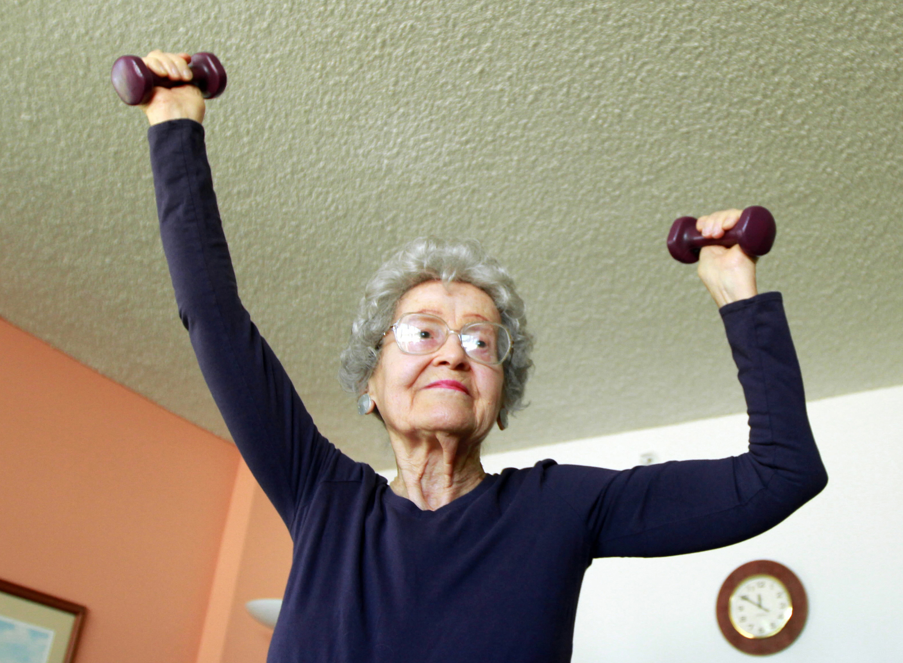 Depression In The Elderly - An Elderly Woman Lifting Weights