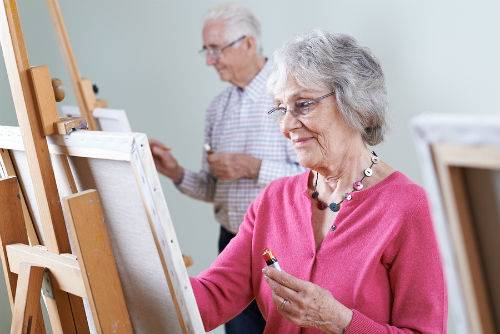 Depression In The Elderly - Elderly Woman Painting In Class
