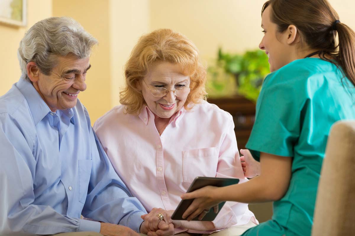 Health Literacy - Older Couple Talking To Nurse