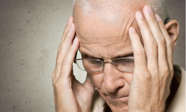 Stroke Warning Signs - An Older Man Rubbing His Temples