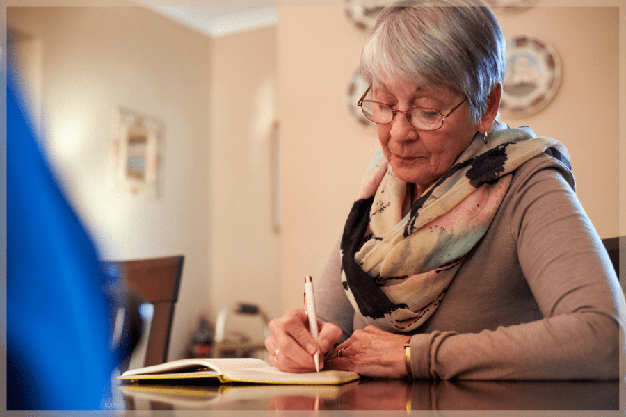 How To Talk To Your Parent's Doctor - Senior woman writing in a notebook - MeetCaregivers