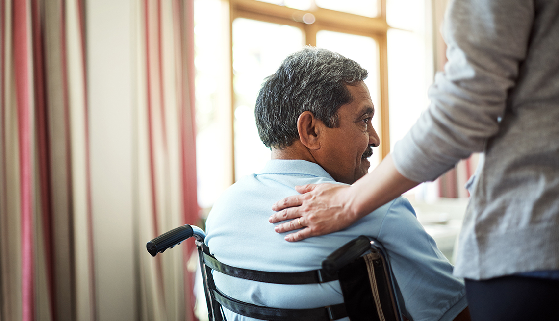 Senior Veterans - A Senior Man Sitting In A Wheelchair With A Hand On His Shoulder