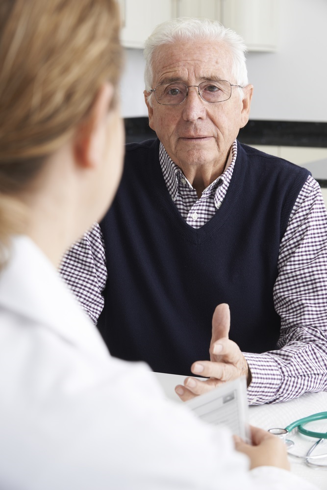 Worried Senior Man Meeting With Doctor In Surgery