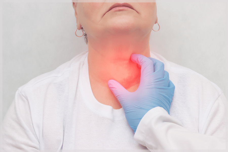 Thyroid Awareness Month - Doctor checking patient's thyroid gland - MeetCaregivers