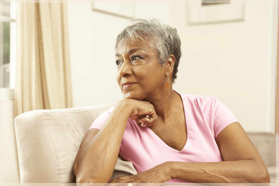 Senior dating Senior woman sitting in her armchair looking out the window pensively MeetCaregivers