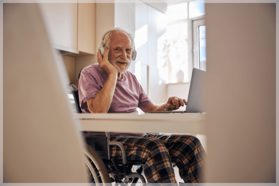 https://meetcaregivers.com/wp-content/uploads/2020/03/Activities-for-seniors-with-limited-mobility-Senior-man-listening-to-music-at-the-kitchen-table-MeetCaregivers.png