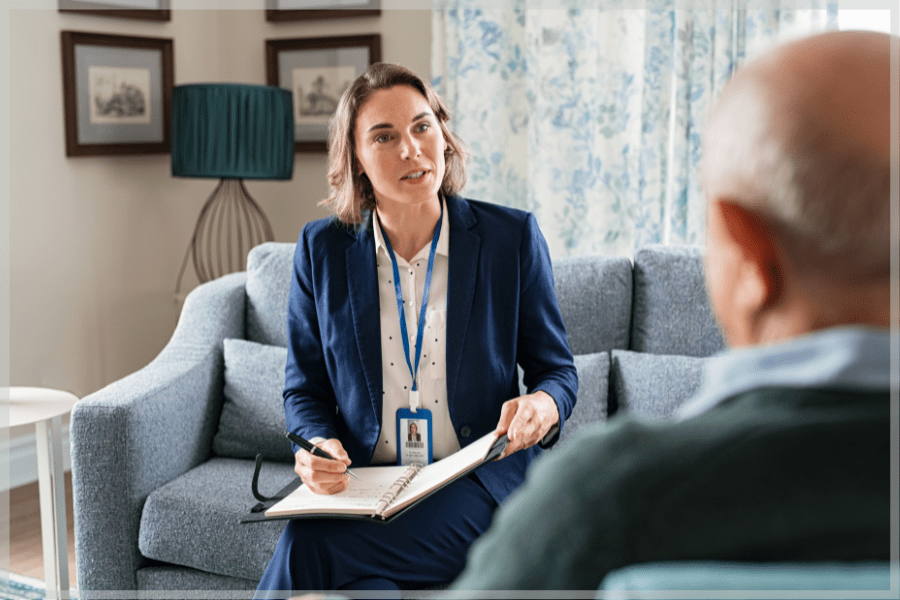 Counseling Awareness Month - In-home therapist talking to an elderly patient.