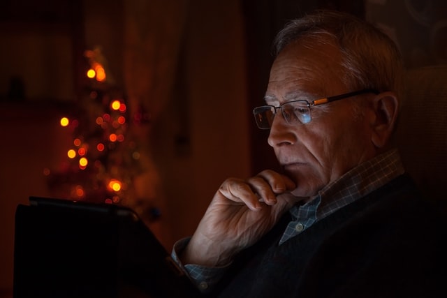 national-public-health-week-an-older-man-looking-at-his-tablet
