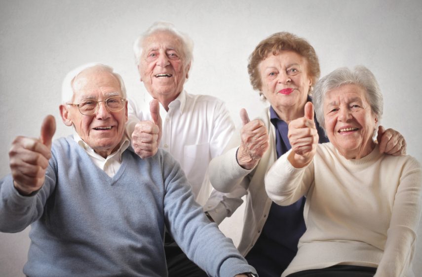 counseling-awareness-month-a-group-of-four-seniors-smiling-and-giving-the-thumbs-up