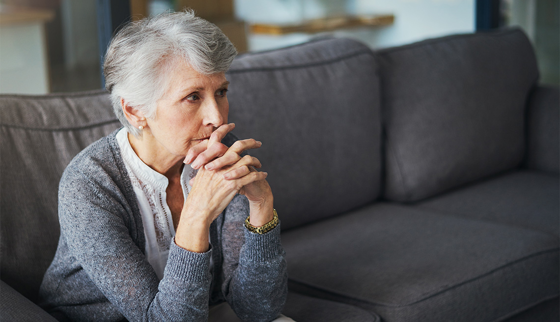 mental-health-month-pensive-senior-woman-sitting-on-the-couch