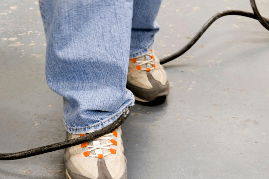 Home Modifications For Visually Impaired – Man stepping over a cable – MeetCaregivers