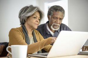 Home Care Services - An Elderly Couple At A Laptop