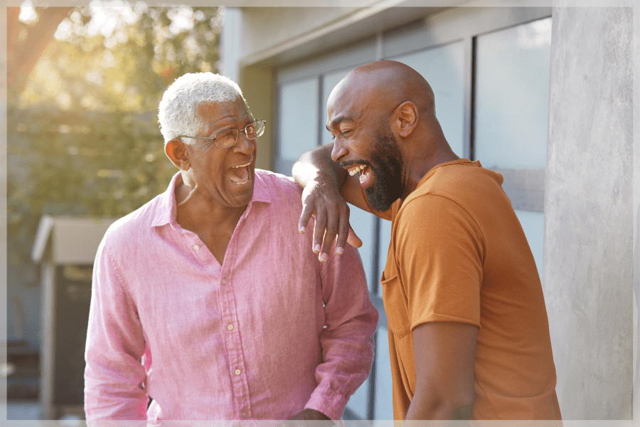 Resources for family caregivers - Senior father and adult son laughing outside - MeetCaregivers