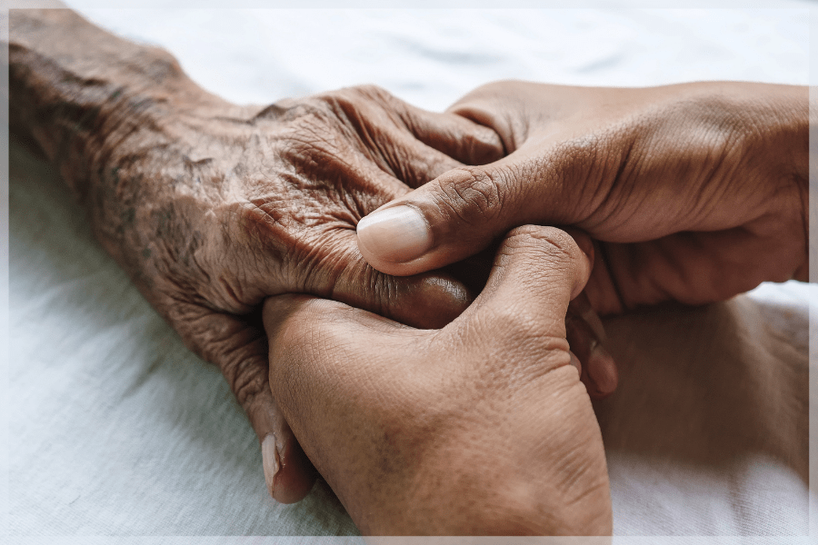 Resources for family caregivers - Young person's hands holding an elderly person's hands - MeetCaregivers