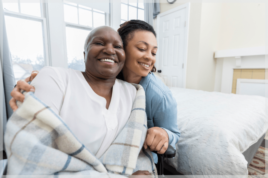 Organization Tips For Caregivers - Mother and daughter smiling together - MeetCaregivers