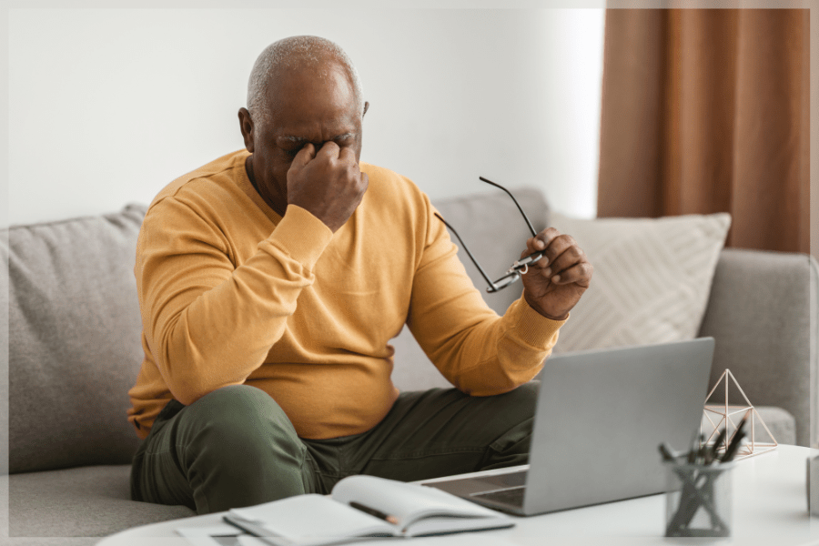 Glaucoma Awareness Month Senior man rubbing bridge of his nose MeetCaregivers