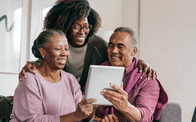 elderly-couple-attending-virtual-memory-cafe-with-their-adult-daughter