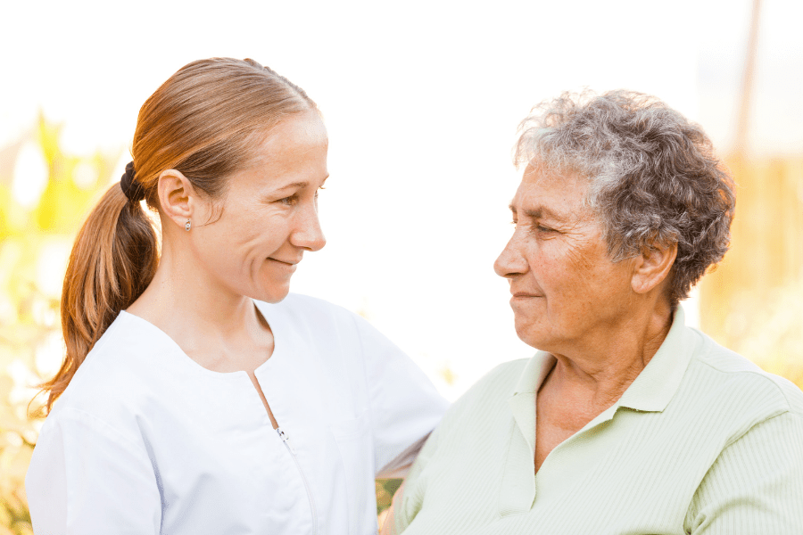 adult-daughter-talking-to-her-older-mother-about-the-credit-for-caring-act