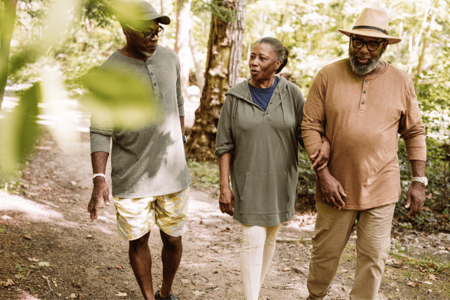 Three older adults trying walking as one of the many activities for seniors