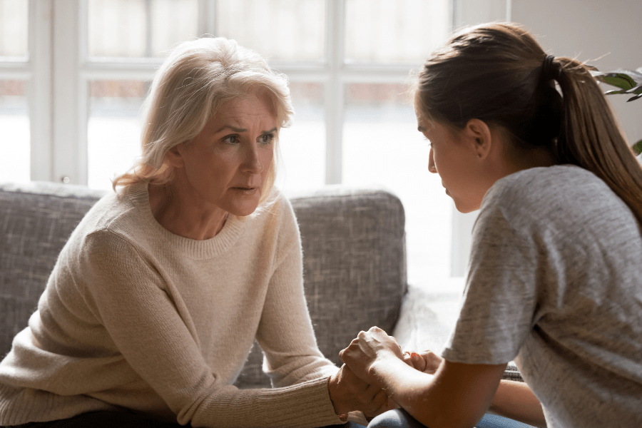 Adult daughter talking to her concerned mother about aging in place.
