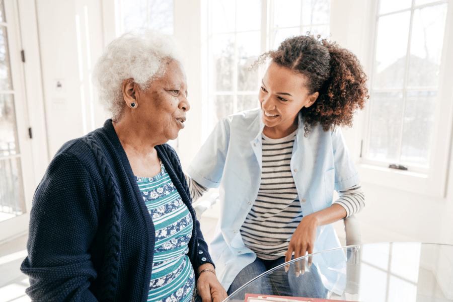 Certified Caregiver Keeping Her Elderly Client Company