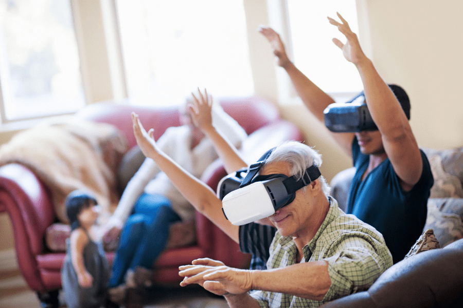 Multigenerational family living with elderly parents playing VR together