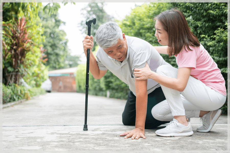 Balance and falling in the elderly - woman helping fallen elderly man - MeetCaregivers
