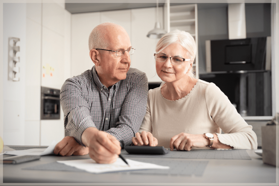 Senior couple discussing how to create a care plan at home - MeetCaregivers