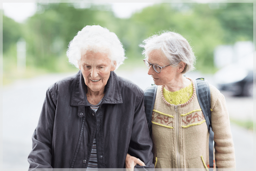 Caregiver Stress Syndrome Two elderly woman walking outside MeetCaregivers