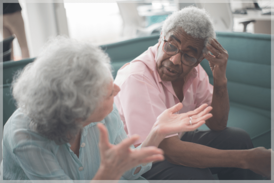 Dementia caregiver support group Older woman and man having a heated conversation MeetCaregivers