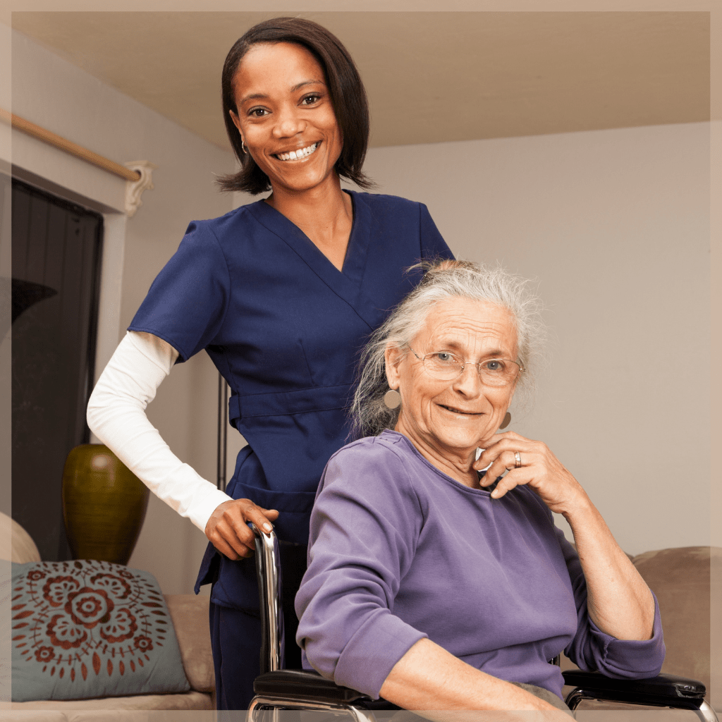 How much do caregivers make - Smiling caregiver pushing happy senior woman in her wheelchair - MeetCaregivers