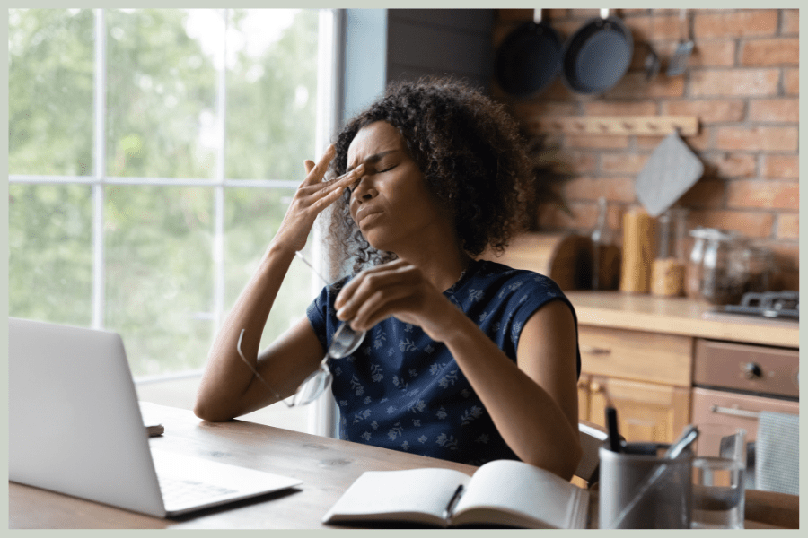 Caregiver Burnout-Frustrated Woman Sitting in Front of Laptop-MeetCaregivers