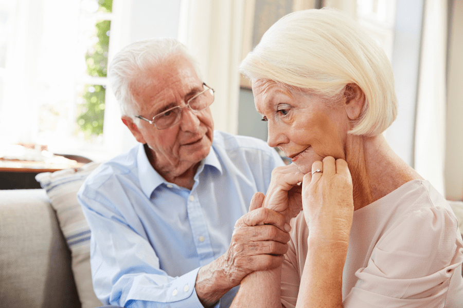 Dementia Home Care - Elderly Man Comforting Wife With Depression At Home