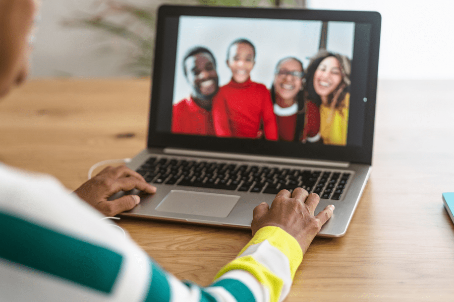 Happy family having a video call on the laptop