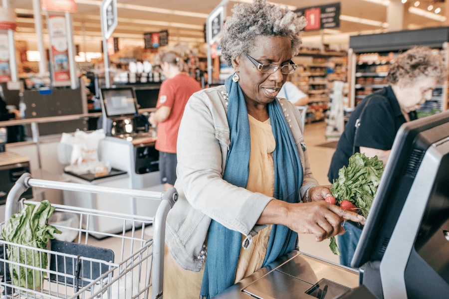 National Nutrition Month – Senior woman using self-checkout at the grocery store